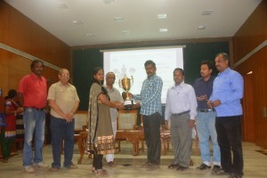 Photo Caption: (L TO R) : R Chandrasekaran, Physical Director, TCE, Mr.Vasudevan, Deen, TCE,  IM Ramnatha Balasubramaniam receiving trophy from R Preethi, former world u-18 silver medallist, Dr.Abhai Kumar, Principal, TCE , B.T.Sethuraman, Secretary, MDCA, S Ganesh Babu, Chief Arbiter, Raajesh G K, Placement officer, TCE.